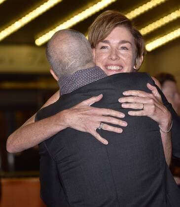 Julianne Nicholson hugs director Craig Gillespie as they arrive for the world premiere of I, Tonya at the Princess of Wales Theatre during the Toronto International Film Festival in Toronto, Canada on September 8, 2017.  TOR2017090839 CHRISTINExCHEW