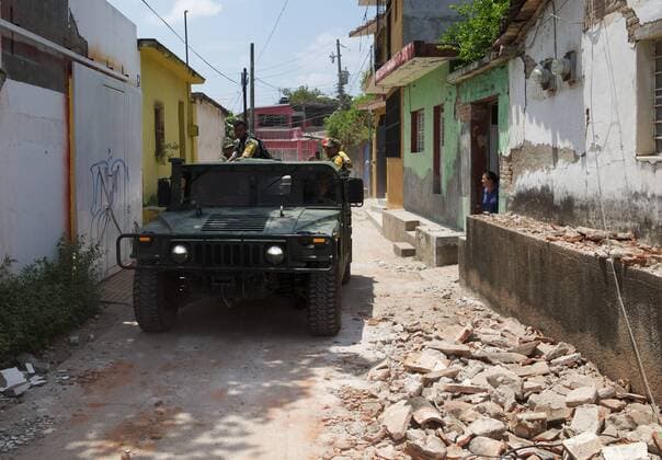 (170910) -- JUCHITAN (MEXICO), Sept. 10, 2017 -- A military vehicle inspects a street after an earthquake hit in Juchitan, Oaxaca state, Mexico, Sept. 9, 2017. A powerful earthquake measuring 8.2 on the Richter scale struck off Mexico s southern coast late Thursday night, killing 90 people. ) MEXICO-OAXACA-JUCHITAN-EARTHQUAKE DanxHang 