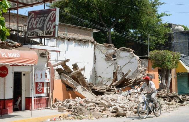 Rescue, relief efforts continue in Mexico as quake death toll rises A man passes by a destroyed building in Juchitan, southern Mexico, on Sept. 9, 2017, two days after the strongest earthquake to hit the country since 1985. 