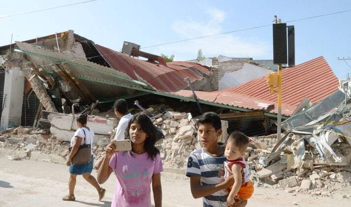 Quake destruction a nightmare for Mexican town People pass by the rubble of a collapsed clothing store in Juchitan, a town in southern Mexico s Oaxaca, on Sept. 9, 2017, two days after the strongest earthquake to hit the country since 1985. Oaxaca state bore the brunt of casualties and damage caused by the magnitude-8.1 quake. 