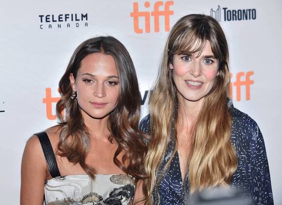 Alicia Vikander (L) and director Lisa Langseth arrive at the Toronto International Film Festival premiere of Euphoria at the Winter Garden Theatre in Toronto, Canada on September 11, 2017.  TOR2017091134 CHRISTINExCHEW