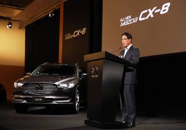 September 14, 2017, Tokyo, Japan - Japan s automaker Mazda president Masamichi Kogai introduces the new sports utility vehicle (SUV) CX-8 in Tokyo on Thursday, September 14, 2017. The new crossover SUV has a turbo charged 2.2-litre diesel engine to drive three-row seats roomy body.  (lwxa013591)