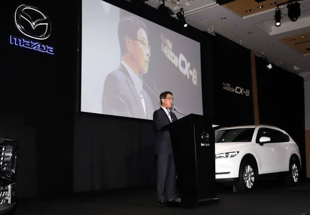 September 14, 2017, Tokyo, Japan - Japan s automaker Mazda president Masamichi Kogai introduces the new sports utility vehicle (SUV) CX-8 in Tokyo on Thursday, September 14, 2017. The new crossover SUV has a turbo charged 2.2-litre diesel engine to drive three-row seats roomy body.  (lwxa013593)