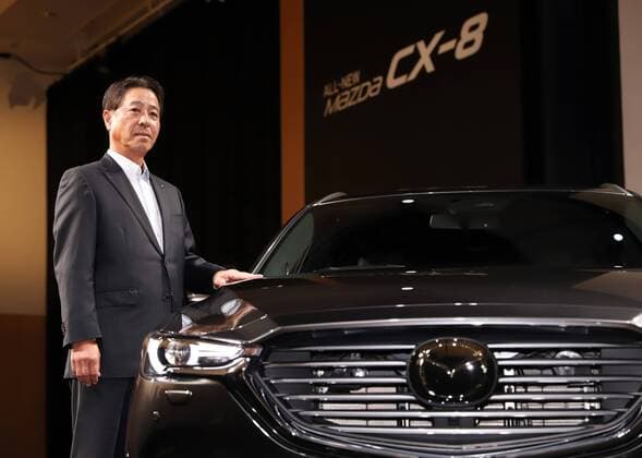 September 14, 2017, Tokyo, Japan - Japan s automaker Mazda president Masamichi Kogai displays the new sports utility vehicle (SUV) CX-8 in Tokyo on Thursday, September 14, 2017. The new crossover SUV has a turbo charged 2.2-litre diesel engine to drive three-row seats roomy body.  (lwxa013596)