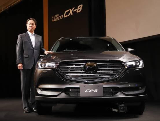 September 14, 2017, Tokyo, Japan - Japan s automaker Mazda president Masamichi Kogai displays the new sports utility vehicle (SUV) CX-8 in Tokyo on Thursday, September 14, 2017. The new crossover SUV has a turbo charged 2.2-litre diesel engine to drive three-row seats roomy body.  (lwxa013597)
