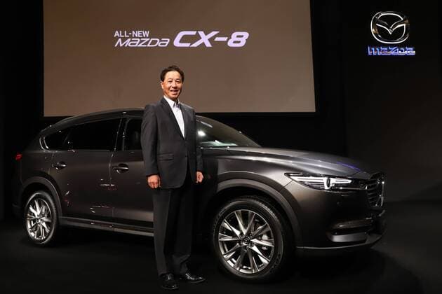 September 14, 2017, Tokyo, Japan - Japan s automaker Mazda president Masamichi Kogai displays the new sports utility vehicle (SUV) CX-8 in Tokyo on Thursday, September 14, 2017. The new crossover SUV has a turbo charged 2.2-litre diesel engine to drive three-row seats roomy body.  (lwxa013598)