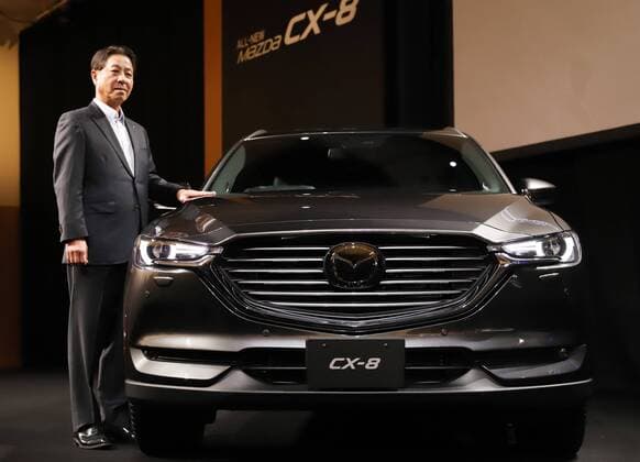 September 14, 2017, Tokyo, Japan - Japan s automaker Mazda president Masamichi Kogai displays the new sports utility vehicle (SUV) CX-8 in Tokyo on Thursday, September 14, 2017. The new crossover SUV has a turbo charged 2.2-litre diesel engine to drive three-row seats roomy body.  (lwxa013601)