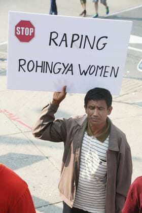 September 16, 2017 - Toronto, ONTARIO, Canada - Protestor holds a sign saying Stop raping Rohingya women as hundreds of demonstrators marched to protest against the violence against Rohingyas in Myanmar, in Toronto, Canada on September 16, 2017. Protestors called for Canada to pressure the United Nations to urge the government of Myanmar to stop the violence against Rohingya Muslims and allow Canada to investigate into the claims of genocide. Nearly 400,000 Rohingya refugees have fled into Bangladesh since late August during the outbreak of violence in the Rakhine state in Myanmar. The United Nations has called the longstanding crisis in Buddhist-majority Myanmar a textbook example of ethnic cleansing. Toronto Canada  - ZUMAn230 20170916_zaa_n230_946 Copyright: xCreativexTouchxImagingxLtdx