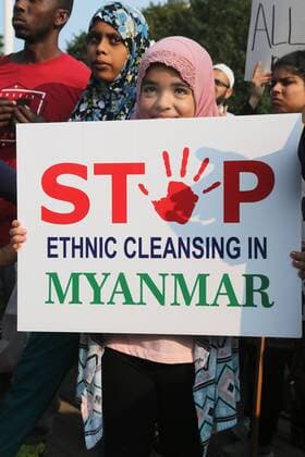 September 16, 2017 - Toronto, ONTARIO, Canada - Muslim girl holds a sign saying Stop ethnic cleansing in Myanmar as hundreds of demonstrators marched to protest against the violence against Rohingyas in Myanmar, in Toronto, Canada on September 16, 2017. Protestors called for Canada to pressure the United Nations to urge the government of Myanmar to stop the violence against Rohingya Muslims and allow Canada to investigate into the claims of genocide. Nearly 400,000 Rohingya refugees have fled into Bangladesh since late August during the outbreak of violence in the Rakhine state in Myanmar. The United Nations has called the longstanding crisis in Buddhist-majority Myanmar a textbook example of ethnic cleansing. Toronto Canada  - ZUMAn230 20170916_zaa_n230_942 Copyright: xCreativexTouchxImagingxLtdx