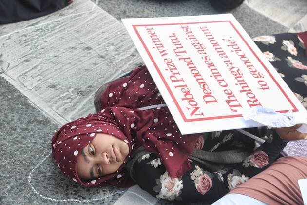 September 16, 2017 - Toronto, ONTARIO, Canada - Protesters lie on the road and block traffic as they mimic the dead (with chalk outlines around their bodies) as hundreds of demonstrators marched to protest against the violence against Rohingyas in Myanmar, in Toronto, Canada on September 16, 2017. Protestors called for Canada to pressure the United Nations to urge the government of Myanmar to stop the violence against Rohingya Muslims and allow Canada to investigate into the claims of genocide. Nearly 400,000 Rohingya refugees have fled into Bangladesh since late August during the outbreak of violence in the Rakhine state in Myanmar. The United Nations has called the longstanding crisis in Buddhist-majority Myanmar a textbook example of ethnic cleansing. Toronto Canada  - ZUMAn230 20170916_zaa_n230_939 Copyright: xCreativexTouchxImagingxLtdx
