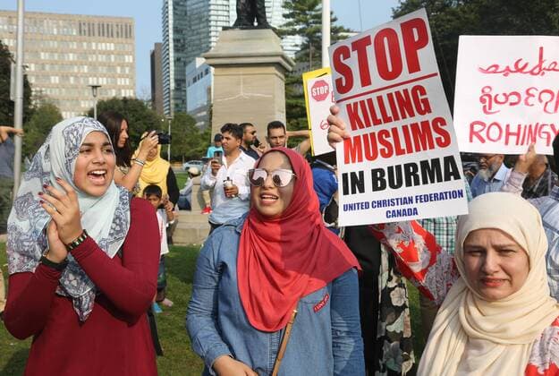 September 16, 2017 - Toronto, ONTARIO, Canada - Muslim girls chant slogans of support for the Rohingya Muslims as hundreds of demonstrators marched to protest against the violence against Rohingyas in Myanmar, in Toronto, Canada on September 16, 2017. Protestors called for Canada to pressure the United Nations to urge the government of Myanmar to stop the violence against Rohingya Muslims and allow Canada to investigate into the claims of genocide. Nearly 400,000 Rohingya refugees have fled into Bangladesh since late August during the outbreak of violence in the Rakhine state in Myanmar. The United Nations has called the longstanding crisis in Buddhist-majority Myanmar a textbook example of ethnic cleansing. Toronto Canada  - ZUMAn230 20170916_zaa_n230_943 Copyright: xCreativexTouchxImagingxLtdx