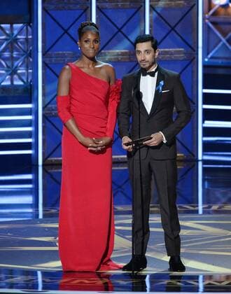 Actors Issa Rae (L) and Riz Ahmed onstage during the 69th annual Primetime Emmy Awards at Microsoft Theater in Los Angeles on September 17, 2017.  LAP201709170140 JIMxRUYMEN