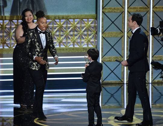 Writer Lena Waithe accepts the award for Outstanding Writing for a Comedy Series for Master of None from actor Iain Armitage onstage during the 69th annual Primetime Emmy Awards at Microsoft Theater in Los Angeles on September 17, 2017.  LAP201709170185 JIMxRUYMEN