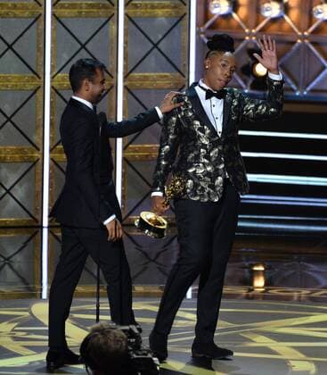 Writers Aziz Ansari (L) and Lena Waithe accept the award for Outstanding Writing for a Comedy Series for Master of None onstage during the 69th annual Primetime Emmy Awards at Microsoft Theater in Los Angeles on September 17, 2017.  LAP201709170191 JIMxRUYMEN
