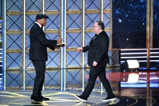 Actor LL Cool J presents the award for Outstanding Writing for a Drama Series to writer Bruce Miller for The Handmaid s Tale onstage during the 69th annual Primetime Emmy Awards at Microsoft Theater in Los Angeles on September 17, 2017.  LAP201709170196 JIMxRUYMEN