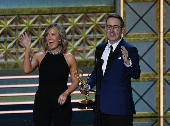 John Oliver is accompanied by executive producer Liz Stanton as he accepts the award for Outstanding Variety Talk Series for Last Week Tonight With John Oliver onstage during the 69th annual Primetime Emmy Awards at Microsoft Theater in Los Angeles on September 17, 2017.  LAP201709170307 JIMxRUYMEN