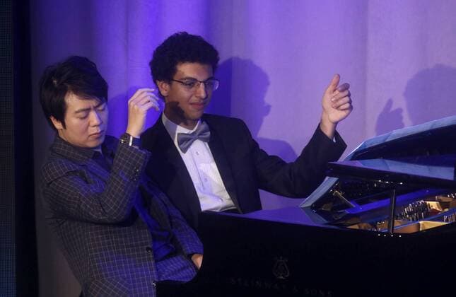 September 19, 2017 - New York, New York, U.S. - Award recipient Chinese pianist LANG LANG and his student AMIR SIRAJ perform at the Atlantic Council 2017 Global Citizen Awards held at the Intrepid Sea, Air, & Space Museum. New York U.S. - ZUMAk03_ 20170919_zaf_k03_125 Copyright: xNancyxKaszermanx
