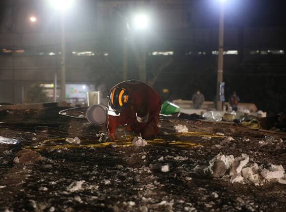 (170920) -- MEXICO CITY, Sept. 20, 2017 -- A rescuer searches for survivors on the debris of a building in Mexico City, Capital of Mexico, on Sept. 20, 2017. Over 220 people have been killed after a powerful earthquake hit central Mexico on Tuesday, with the death toll expected to rise due to the scale of the temblor, the country s civil protection agency said. ) MEXICO-MEXICO CITY-EARTHQUAKE DanxHang 