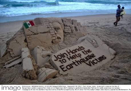 September 20, 2017 - Puri, Orissa, India - A sand art is seen on the Bay of Bengal Sea s eastern coast at Puri, India, on 21 September 2017 creating by sand artist Sudarshan Pattnaik for public awareness and spread message to all over the World to help the victims of the Mexico earthquake, 65 km away from the eastern Indian state Odisha s capital city Bhubaneswar. Puri India  - ZUMAn230 20170920_zaa_n230_509 Copyright: xStrx