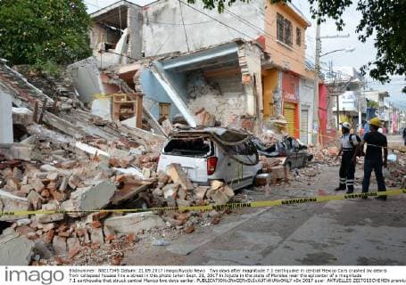 Two days after magnitude 7.1 earthquake in central Mexico Cars crushed by debris from collapsed houses line a street in this photo taken Sept. 21, 2017 in Jojutla in the state of Morelos near the epicenter of a magnitude 7.1 earthquake that struck central Mexico two days earlier. 