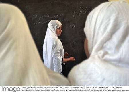 (170926) -- KANDAHAR, Sep. 26, 2017 -- File photo taken on Sept. 16, 2017 shows an Afghan female student attends in a class at a high school in Kandahar province, Afghanistan. While peace and security has been restored in major parts of the once troubled southern region of Afghanistan, there remains a disproportionately large number of girls who have been deprived of the opportunity to complete school in the southern Kandahar province. ) (swt) AFGHANISTAN-KANDAHAR-FEMALE STUDENTS-INSURGENCY MananxArghand 