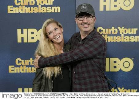 Kate Norley and John Oliver arrive on the red carpet at the Curb Your Enthusiasm season 9 premiere at SVA Theater on September 27, 2017 in New York City.  NYP20170927135 JOHNxANGELILLO