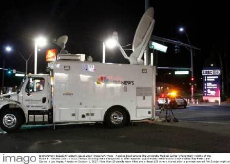 A police block around the University Medical Center where many victims of the Route 91 Harvest country music festival shooting were transported to after apparent gun fire was heard around the Mandalay Bay Resort and Casino in Las Vegas, Nevada on October 1, 2017. More than 20 people were killed and at least 100 others injured after a gunman opened fire Sunday night at a country music festival opposite the Mandalay Bay hotel and resort on the Las Vegas Strip, authorities said.  LAV2017100222 JAMESxATOA