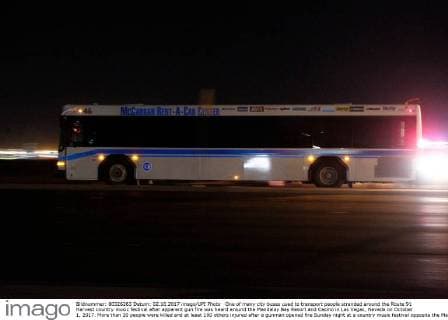 One of many city buses used to transport people stranded around the Route 91 Harvest country music festival after apparent gun fire was heard around the Mandalay Bay Resort and Casino in Las Vegas, Nevada on October 1, 2017. More than 20 people were killed and at least 100 others injured after a gunman opened fire Sunday night at a country music festival opposite the Mandalay Bay hotel and resort on the Las Vegas Strip, authorities said.  LAV2017100211 JAMESxATOA