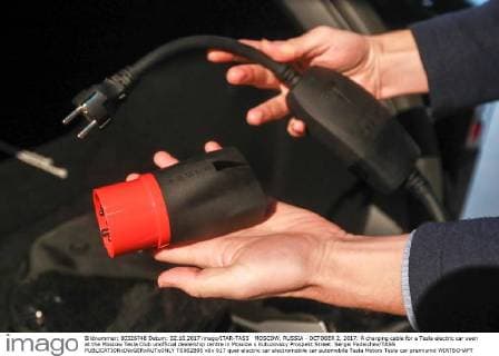 MOSCOW, RUSSIA - OCTOBER 2, 2017: A charging cable for a Tesla electric car seen at the Moscow Tesla Club unofficial dealership centre in Moscow s Kutuzovsky Prospekt Street. Sergei Fadeichev TASS  TS062B95