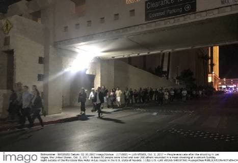 (171002) -- LAS VEGAS, Oct. 2, 2017 -- People evacuate after the shooting in Las Vegas, the United States, Oct. 2, 2017. At least 50 people were killed and over 200 others wounded in a mass shooting at a concert Sunday night outside of the Mandalay Bay Hotel in Las Vegas in the U.S. state of Nevada. ) (djj) U.S.-LAS VEGAS-SHOOTING HuangxChao 