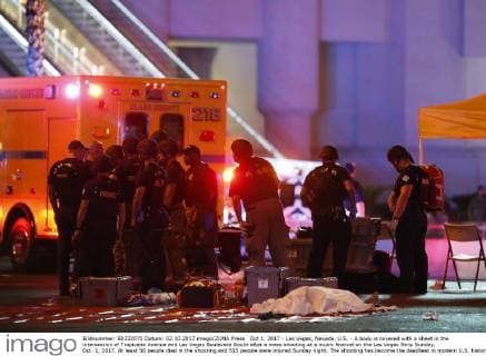 Oct 1, 2017 - Las Vegas, Nevada, U.S. - A body is covered with a sheet in the intersection of Tropicana Avenue and Las Vegas Boulevard South after a mass shooting at a music festival on the Las Vegas Strip Sunday, Oct. 1, 2017. At least 58 people died in the shooting and 515 people were injured Sunday night. The shooting has become the deadliest in modern U.S. history. The suspect, 64-year-old Stephen Paddock, was found dead in his Mandalay Bay hotel room. Las Vegas U.S. - ZUMAl154 20171002_rua_l154_926 Copyright: xStevexMarcus LasxVegasxSunx