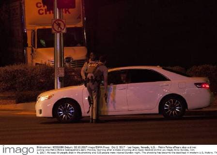 Oct 2, 2017 - Las Vegas, Nevada, U.S. - Metro Police officers stop a driver pulling into Metro Police headquarters early Monday morning after a mass shooting at a music festival on the Las Vegas Strip Sunday, Oct. 1, 2017. At least 58 people died in the shooting and 515 people were injured Sunday night. The shooting has become the deadliest in modern U.S. history. The suspect, 64-year-old Stephen Paddock, was found dead in his Mandalay Bay hotel room. Las Vegas U.S. - ZUMAl154 20171002_rua_l154_930 Copyright: xStevexMarcus LasxVegasxSunx