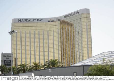 Broken windows on the 32nd floor of the Mandalay Bay Hotel, where a gunman opened fire on attendees of the Route 91 Harvest Festival venue, are seen the day after one of the largest mass murders in America, in Las Vegas, Nevada on October 2, 2017. At least 59 died and 527 were injured, authorities said.  LAV2017100233 JAMESxATOA