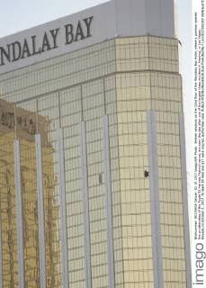 Broken windows on the 32nd floor of the Mandalay Bay Hotel, where a gunman opened fire on attendees of the Route 91 Harvest Festival venue, are seen the day after one of the largest mass murders in America, in Las Vegas, Nevada on October 2, 2017. At least 59 died and 527 were injured, authorities said.  LAV2017100297 JAMESxATOA