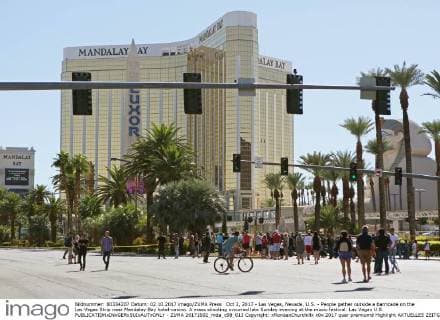 Oct 2, 2017 - Las Vegas, Nevada, U.S. - People gather outside a barricade on the Las Vegas Strip near Mandalay Bay hotel-casino. A mass shooting occurred late Sunday evening at the music festival. Las Vegas U.S.  - ZUMA 20171002_mda_c98_013 Copyright: xRondaxChurchillx