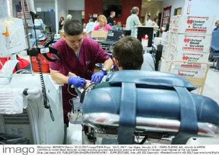 Oct 2, 2017 - Las Vegas, Nevada, U.S. - MARIA ELADRO, left, attends to AARON COFFEEN at United Blood Services. A mass shooting occurred late Sunday evening at the Route 91 Harvest music festival on The Las Vegas Strip. Las Vegas U.S.  - ZUMA 20171002_mda_c98_021 Copyright: xRondaxChurchillx