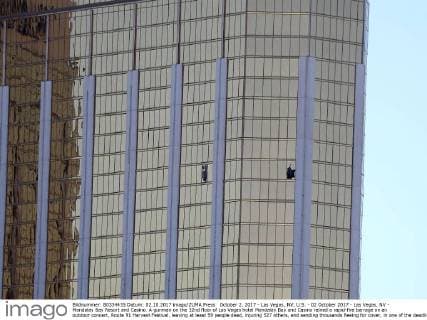 October 2, 2017 - Las Vegas, NV, U.S. - 02 October 2017 - Las Vegas, NV - Mandalay Bay Resort and Casino. A gunman on the 32nd floor of Las Vegas hotel Mandalay Bay and Casino rained a rapid-fire barrage on an outdoor concert, Route 91 Harvest Festival, leaving at least 59 people dead, injuring 527 others, and sending thousands fleeing for cover, in one of the deadliest mass shootings in American history. Photo shows broken windows from the room of shooter Stephen Paddock. Photo Credit: MJT AdMedia Las Vegas U.S. - ZUMAa123 20171002_zaa_a123_021 Copyright: xMjtAdmediax