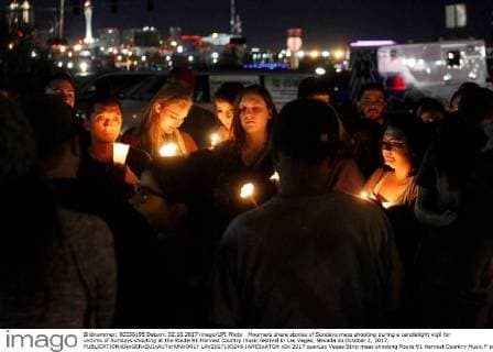 Mourners share stories of Sundays mass shooting during a candlelight vigil for victims of Sundays shooting at the Route 91 Harvest country music festival in Las Vegas, Nevada on October 2, 2017.  LAV2017100248 JAMESxATOA