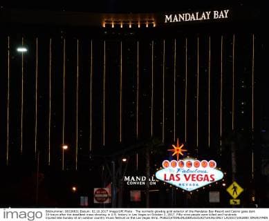 The normally glowing gold exterior of the Mandalay Bay Resort and Casino goes dark 24-hours after the deadliest mass shooting in U.S. history in Las Vegas on October 2, 2017. Fifty-nine people were killed and hundreds injured late Sunday at an outdoor country music festival on the Las Vegas Strip.  LAV20171002800 JIMxRUYMEN