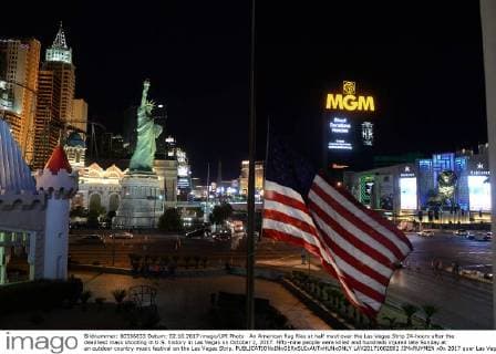 An American flag flies at half mast over the Las Vegas Strip 24-hours after the deadliest mass shooting in U.S. history in Las Vegas on October 2, 2017. Fifty-nine people were killed and hundreds injured late Sunday at an outdoor country music festival on the Las Vegas Strip.  LAV20171002802 JIMxRUYMEN