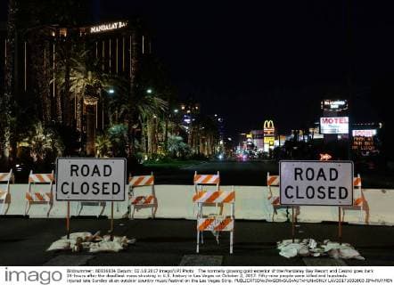 The normally glowing gold exterior of the Mandalay Bay Resort and Casino goes dark 24-hours after the deadliest mass shooting in U.S. history in Las Vegas on October 2, 2017. Fifty-nine people were killed and hundreds injured late Sunday at an outdoor country music festival on the Las Vegas Strip.  LAV20171002803 JIMxRUYMEN