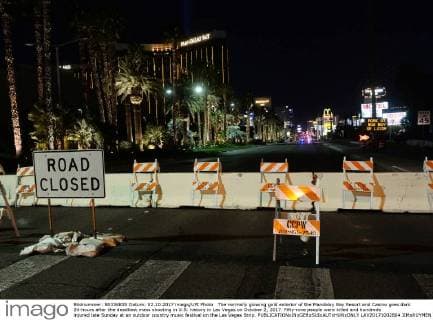 The normally glowing gold exterior of the Mandalay Bay Resort and Casino goes dark 24-hours after the deadliest mass shooting in U.S. history in Las Vegas on October 2, 2017. Fifty-nine people were killed and hundreds injured late Sunday at an outdoor country music festival on the Las Vegas Strip.  LAV20171002804 JIMxRUYMEN