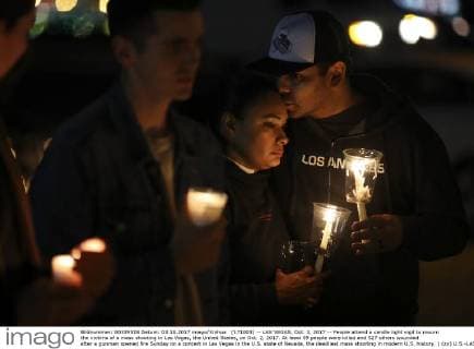 (171003) -- LAS VEGAS, Oct. 3, 2017 -- People attend a candle light vigil to mourn the victims of a mass shooting in Las Vegas, the United States, on Oct. 2, 2017. At least 59 people were killed and 527 others wounded after a gunman opened fire Sunday on a concert in Las Vegas in the U.S. state of Nevada, the deadliest mass shooting in modern U.S. history. ) (zy) U.S.-LAS VEGAS-SHOOTING-MOURNING WangxYing 