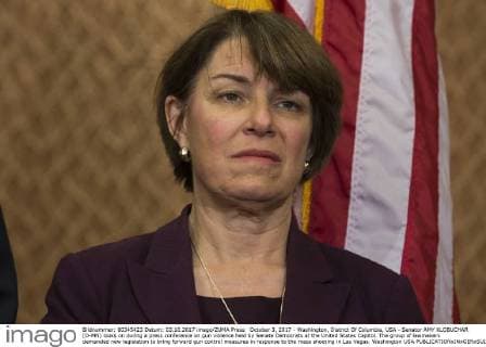 October 3, 2017 - Washington, District Of Columbia, USA - Senator AMY KLOBUCHAR (D-MN) looks on during a press conference on gun violence held by Senate Democrats at the United States Capitol. The group of lawmakers demanded new legislation to bring forward gun control measures in response to the mass shooting in Las Vegas. Washington USA - ZUMAe113 20171003_zap_e113_103 Copyright: xAlexxEdelmanx