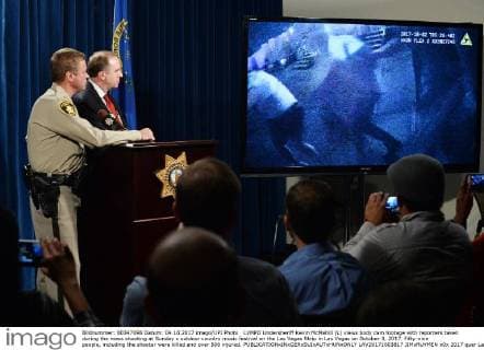 LVMPD Undersheriff Kevin McMahill (L) views body cam footage with reporters taken during the mass shooting at Sunday s outdoor country music festival on the Las Vegas Strip in Las Vegas on October 3, 2017. Fifty-nine people, including the shooter were killed and over 500 injured.  LAV20171003817 JIMxRUYMEN