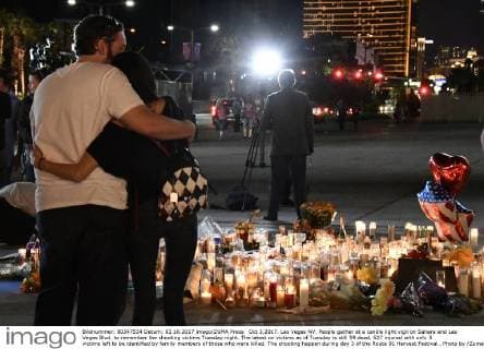 Oct 3,2017. Las Vegas NV. People gather at a candle light vigil on Sahara and Las Vegas Blvd. to remember the shooting victims Tuesday night. The latest on victims as of Tuesday is still 59 dead, 527 injured with only 3 victims left to be identified by family members of those who were killed. The shooting happen during day 3 of the Route 91 Harvest Festival.. Photo by ZumaPress. Las Vegas U.S. - ZUMAbl1_ 20171003_zaf_bl1_047 Copyright: xGenexBlevinsx