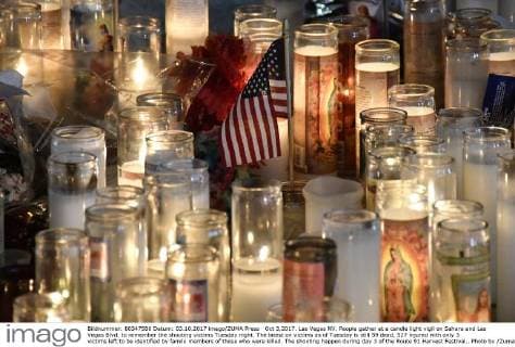 Oct 3,2017. Las Vegas NV. People gather at a candle light vigil on Sahara and Las Vegas Blvd. to remember the shooting victims Tuesday night. The latest on victims as of Tuesday is still 59 dead, 527 injured with only 3 victims left to be identified by family members of those who were killed. The shooting happen during day 3 of the Route 91 Harvest Festival.. Photo by ZumaPress. Las Vegas U.S. - ZUMAbl1_ 20171003_zaf_bl1_045 Copyright: xGenexBlevinsx