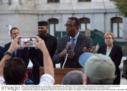 October 3, 2017 - Philadelphia, Pennsylvania, United States - Mimicking shooting an assault riffle Philadelphia Council President Darell Clarke, joined by Mayor Jim Kenney, Pennsylvania Governor Tom Wolf, and gun violence activist, speaks out against gun violence and call for gun law reform, at a October 3, 2017 vigil for the victims of the mass shooting in Las Vegas. The vigil is held outside City Hall, in Philadelphia, PA. Philadelphia United States  - ZUMAn230 20171003_zaa_n230_781 Copyright: xBastiaanxSlabbersx