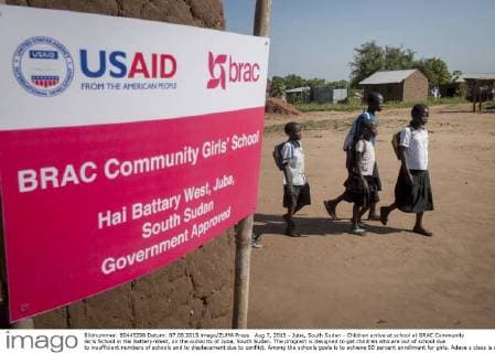 Aug 7, 2015 - Juba, South Sudan - Children arrive at school at BRAC Community Girls School in Hai Battery-West, on the outskirts of Juba, South Sudan. The program is designed to get children who are out of school due to insufficient numbers of schools and to displacement due to conflict. Among the schools goals is to achieve 60 percent enrollment for girls. Adaya s class is designed to develop basic school skills for children who have never been to school before. Juba South Sudan - ZUMAd90_ 20150807_shd_d90_823 Copyright: xRickxD Eliax