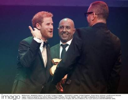 . 12 10 2017. London, United Kingdom. Prince Harry receives a posthumous Attitude Legacy Award on behalf of his mother Diana, Princess of Wales, from Ian Walker, right, and Julian La Bastide at the Attitude Awards in London.  xROTAx xi-Imagesx IIM-16127-0003